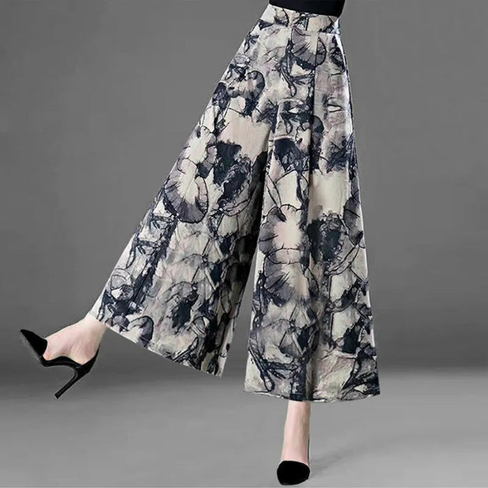 Elegant Stylish 3Sixty5 curve-hugging skirt with a floral abstract pattern and wide leg design