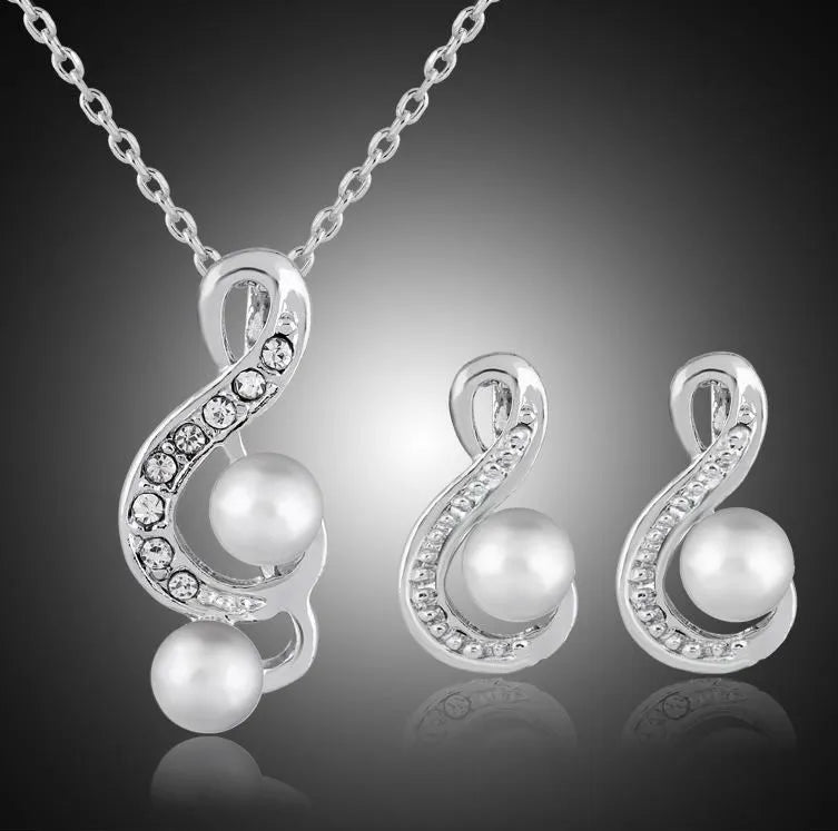 Danbi Pearl Jewelry Set featuring a silver necklace and matching earrings with elegant design and sparkling accents