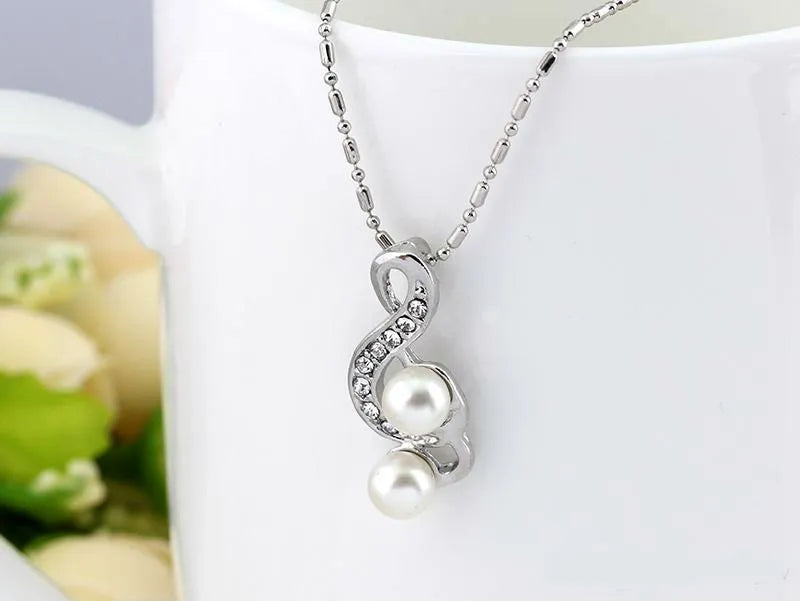 Danbi Pearl Jewelry Set featuring a delicate pearl pendant necklace with shimmering accents