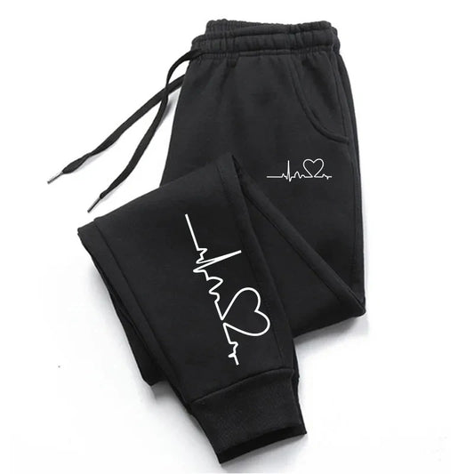Stylish 3Sixty5 everyday glam track pants in black with heart and heartbeat graphic design