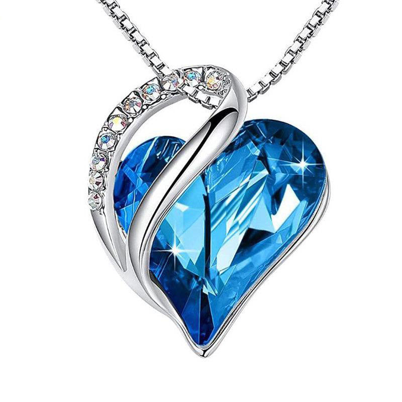 Stylish 3Sixty5 heart-shaped pendant necklace featuring a blue gemstone and sparkling accents