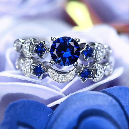 Stylish 3Sixty5 moon and star ring design featuring a blue gemstone and silver accents