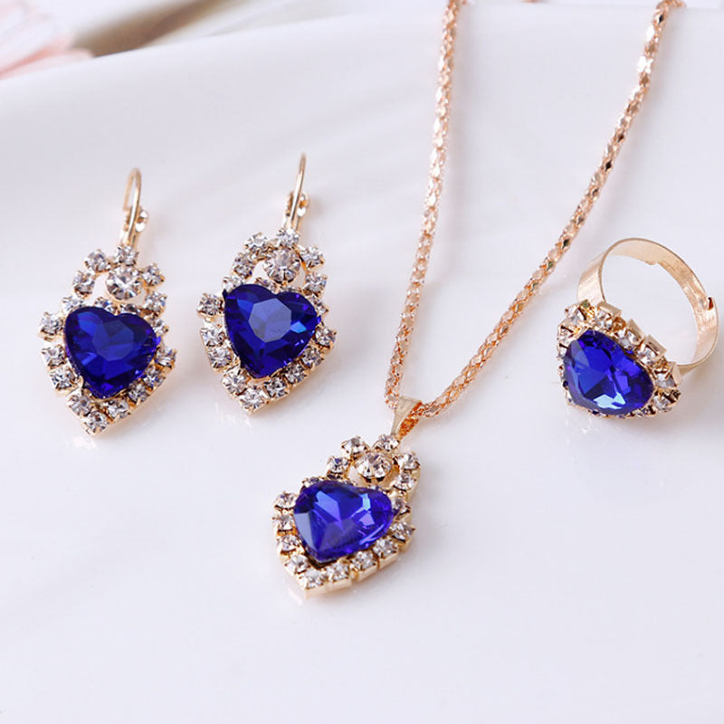 Elegant Stylish 3Sixty5 rhinestone jewelry set with heart-shaped blue gems and gold accents