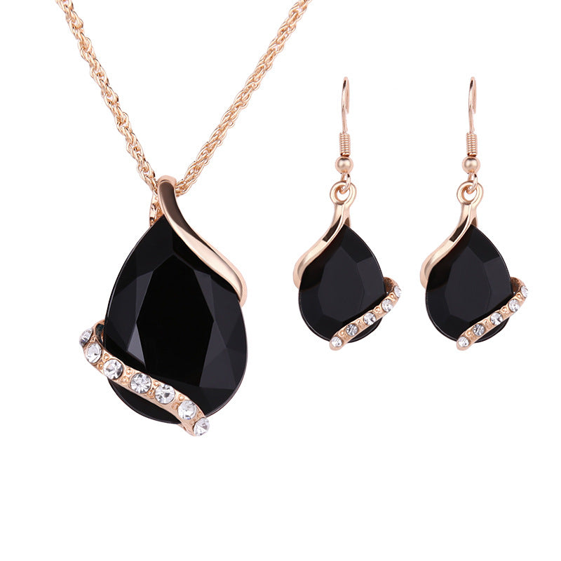 Elegant royal dewdrop jewelry set featuring a black pendant necklace and matching earrings