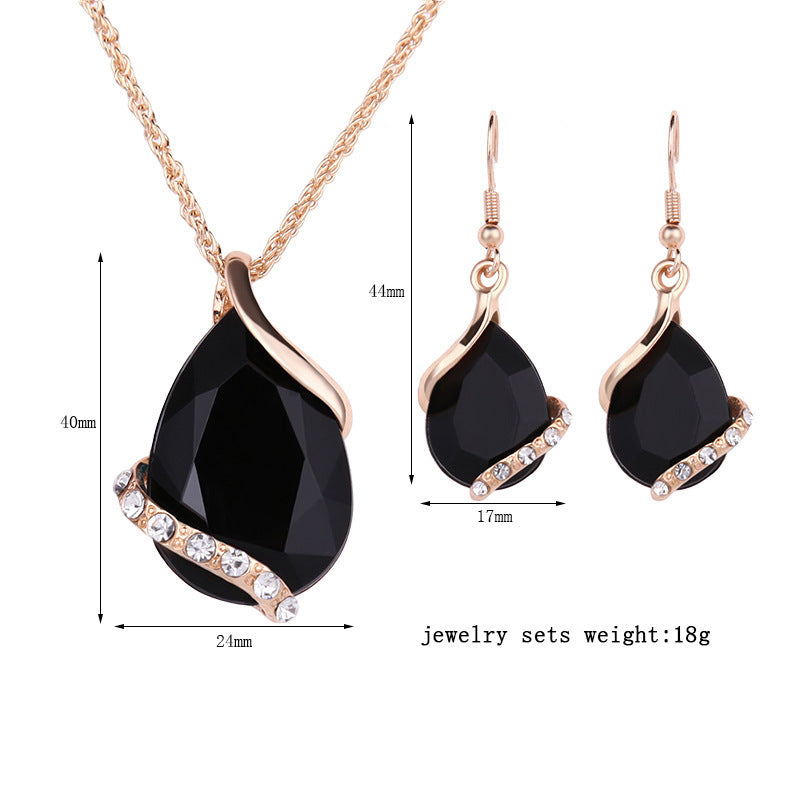 Elegant royal dewdrop jewelry set featuring black gem pendant and matching earrings with sparkling details
