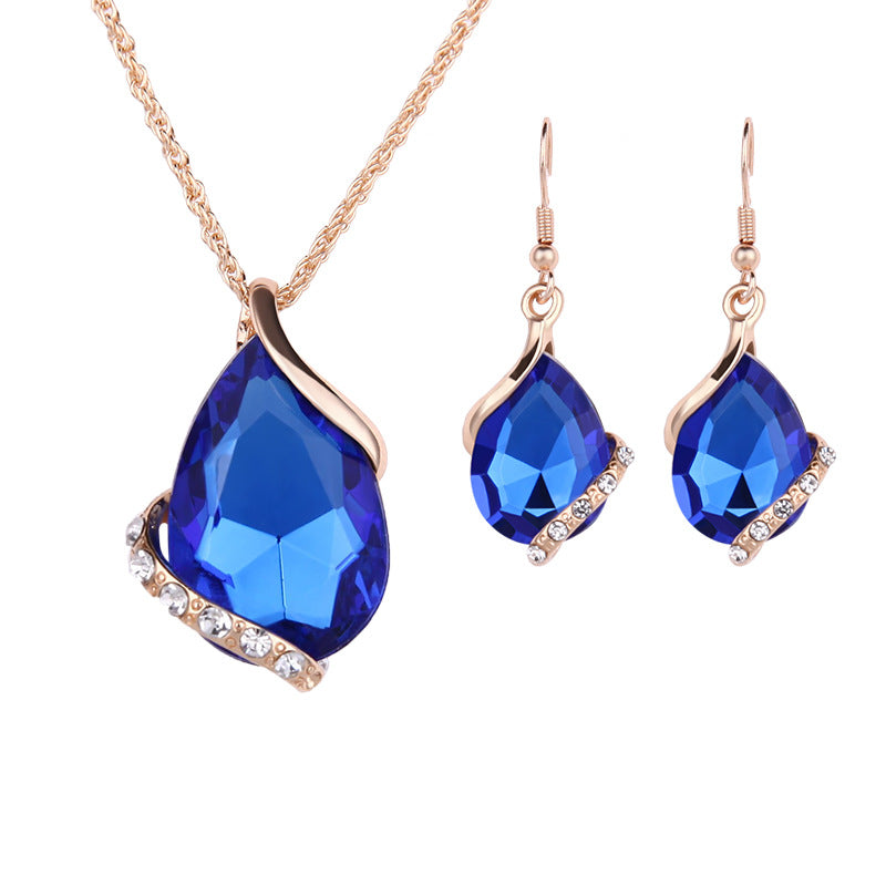 Elegant royal dewdrop jewelry set featuring a blue gemstone pendant necklace and matching earrings
