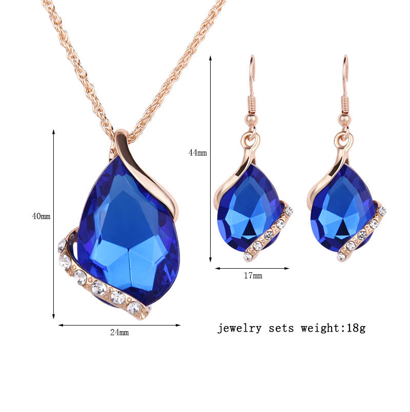 Royal dewdrop jewelry set featuring blue gemstones in a necklace and earrings design