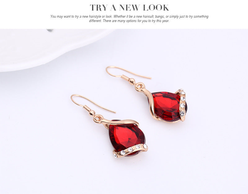 Elegant royal dewdrop jewelry set featuring stunning red earrings with sparkling accents