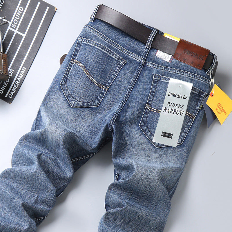 SwiftStyle tailored trousers in blue denim showcasing a modern fit with detailed stitching and belt loops