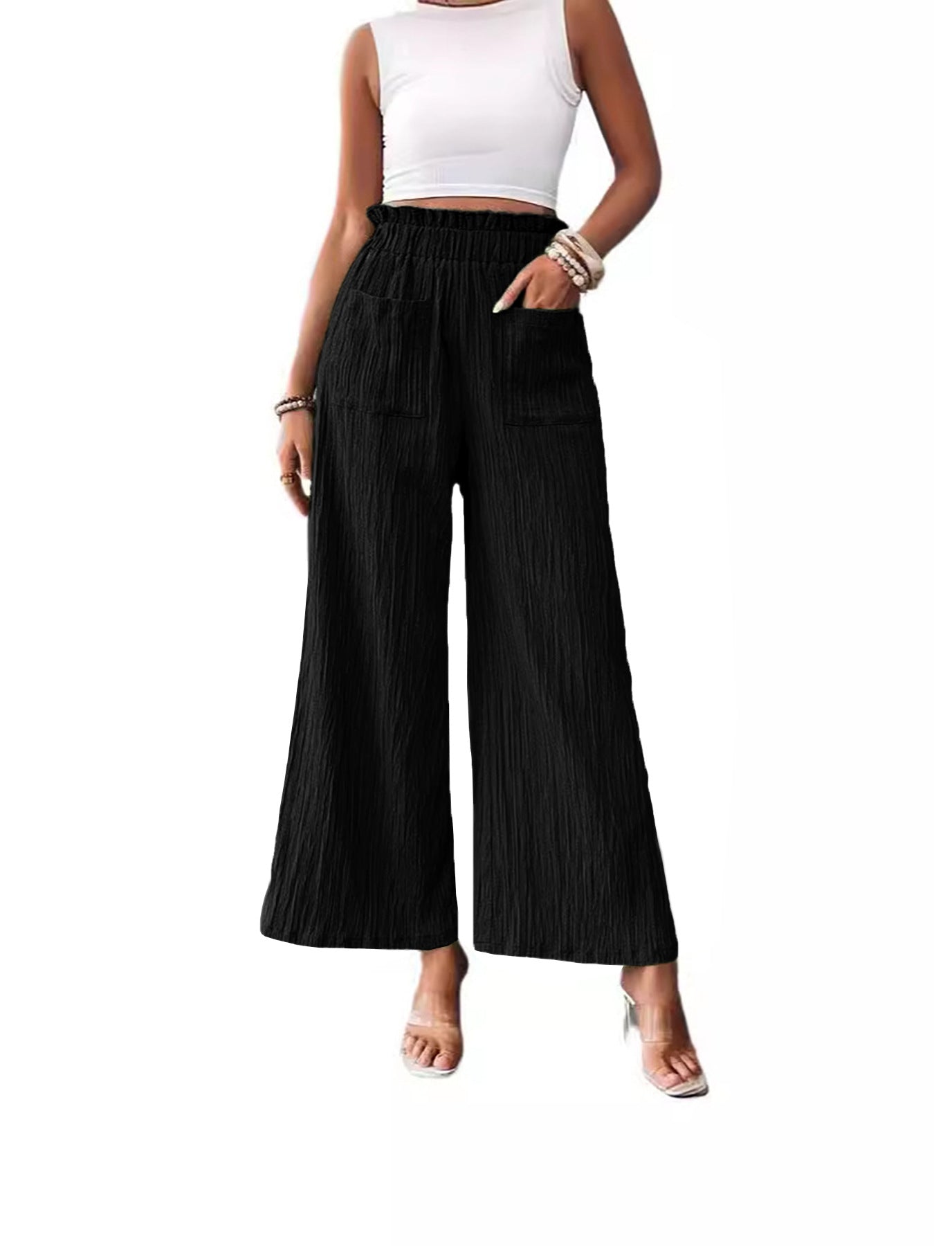 Woman wearing black Smooth Silhouette Pants with a relaxed fit and wide legs, perfect for stylish outfits