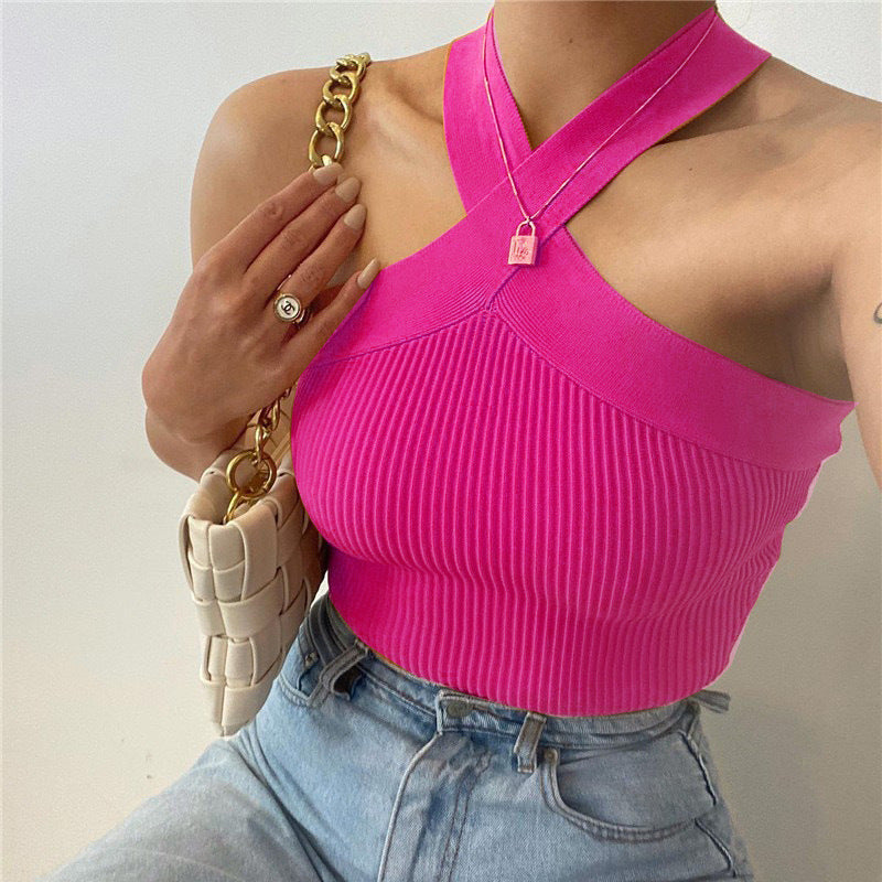 Stylish 3Sixty5 soft stretch knit halter tank in pink paired with high-waisted jeans for a casual look