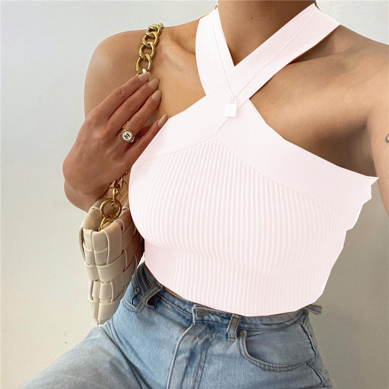 Stylish 3Sixty5 soft stretch knit halter tank in light pink paired with high-waisted jeans