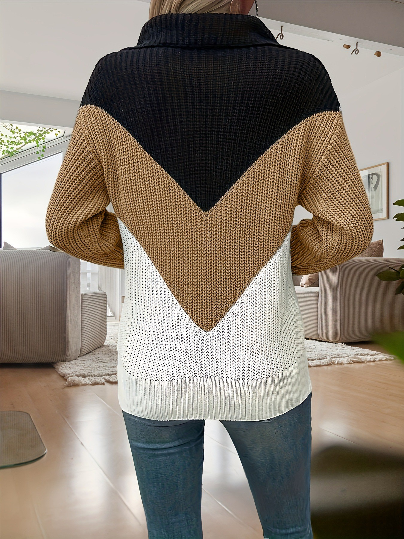 Stylish 3Sixty5 zip contrast lapel sweater in black, beige, and white with a modern chevron design